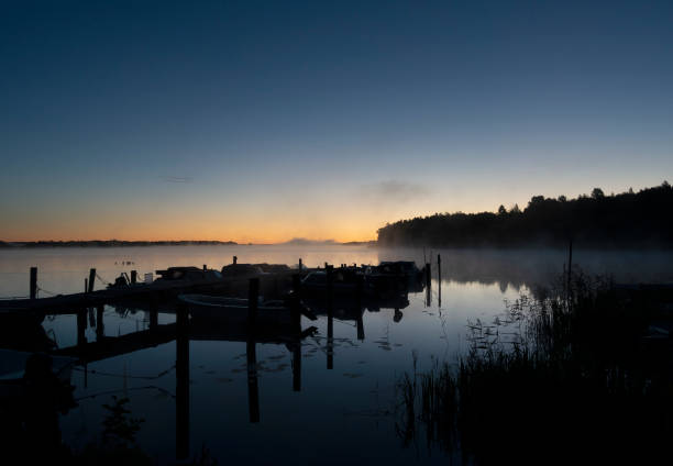 istock Tranquil lake with boats 1271119913