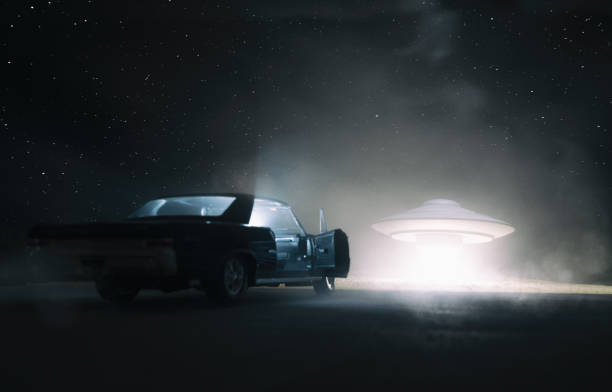 UFO Encounter A UFO hovers over a desert, and an old car is parked in the foreground. Is someone getting abducted, or is someone hitching a ride? kidnapping photos stock pictures, royalty-free photos & images