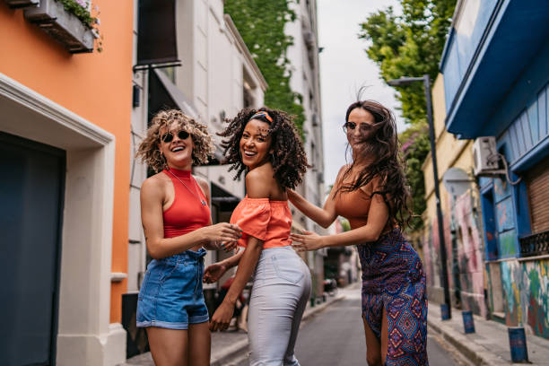 istock Three young women walking and dancing 1271120651