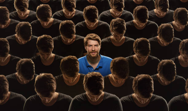 Top view of grey crowd of identical people and special one man, difference and diversity concept Top view of grey crowd of identical people and special one man, difference and diversity concept. Unique among the faceless, not like everyone else. Smiling and confident, feels happy. Collage. individuality stock pictures, royalty-free photos & images
