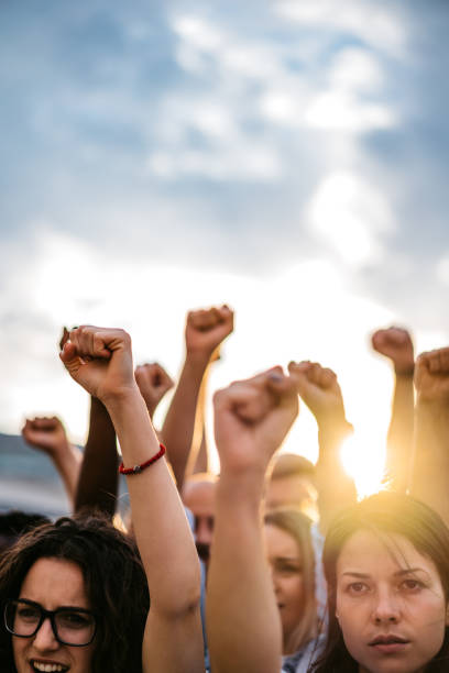 istock Protestors raising fists 1271122739