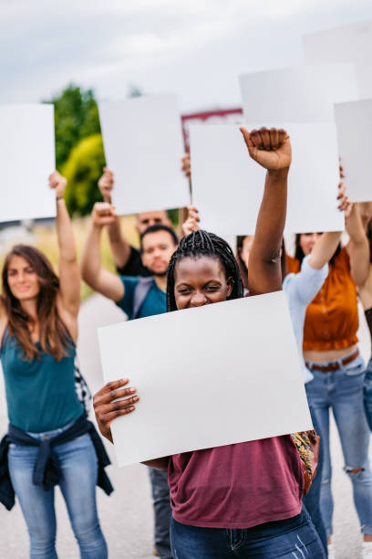 istock Young people protesting at the street 1271122876