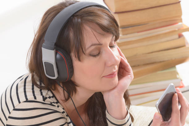 istock Woman listening an audiobook 1271126251