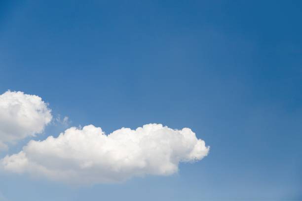istock Clear blue sky and two beautiful white clouds 1271127060