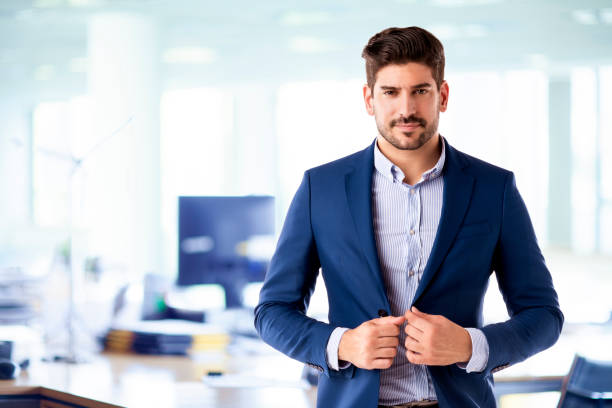 istock Businessman portrait while standing in the office 1271129392