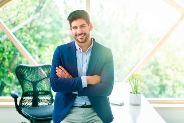 istock Businessman portrait while standing in the office 1271129398