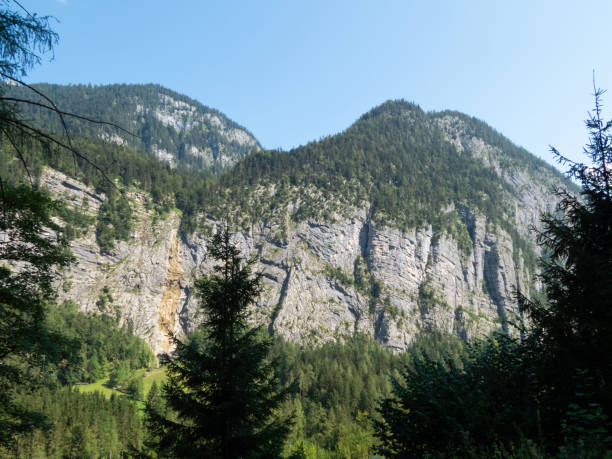 istock Mountain range in front of blue sky 1271129553