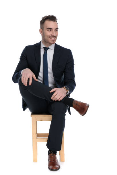 istock Positive businessman smiling and looking away while sitting 1271131086