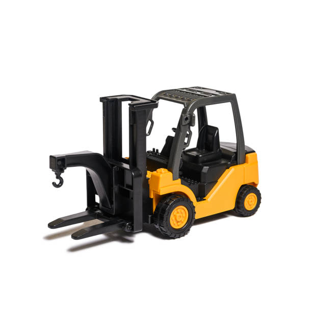 istock children's toy - plastic yellow and black forklift on white background, isolated with shadow 1271132778