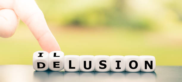 istock Hand turns dice and changes the word delusion to illusion. 1271133064