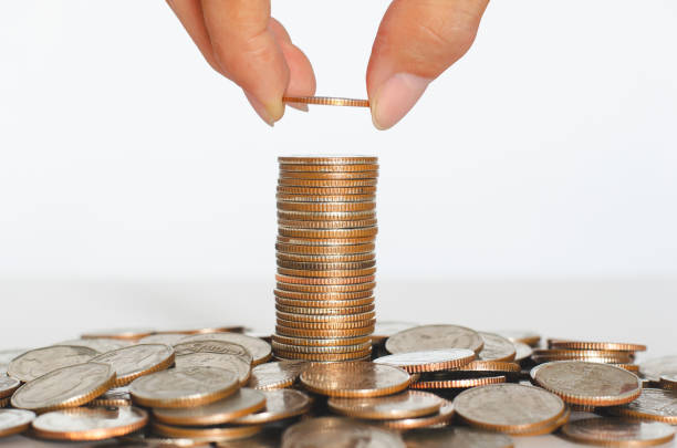 istock business man hand put coin stack growth up isolated on white background. money saving, financial growing, business startup, economy budget and investment concept. 1271134493