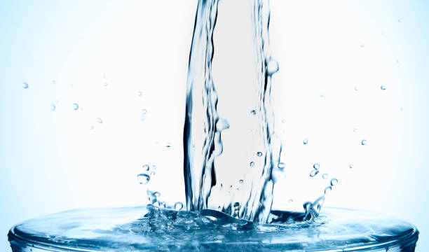 istock Splash of water in a full glass 1271137099