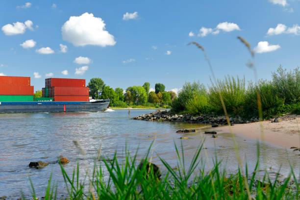 istock Container ship passes the banks of Rodenkirchen 1271142842