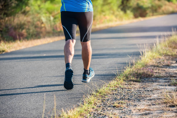 istock middle-aged man running in nature 1271143562