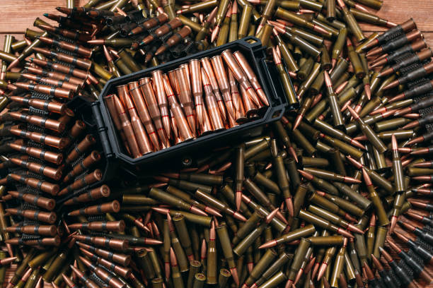 istock Different ammo on wooden background, weapon concept. 1271143670