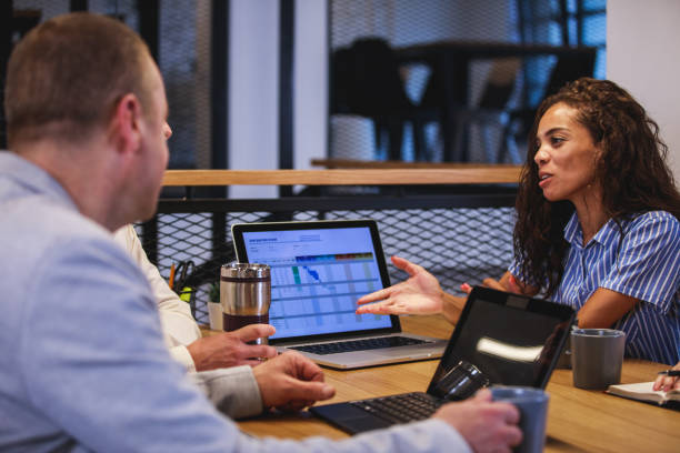 istock Checking with her colleagues last update in information 1271145168