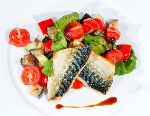 istock Mackerel baked with lemon, cherry tomatoes, vegetables and spices. 1271145196