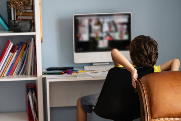istock Elementary Schoolboy Homeschooling On Video Conferencing During Coronavirus Pandemic Quarantine 1271145401