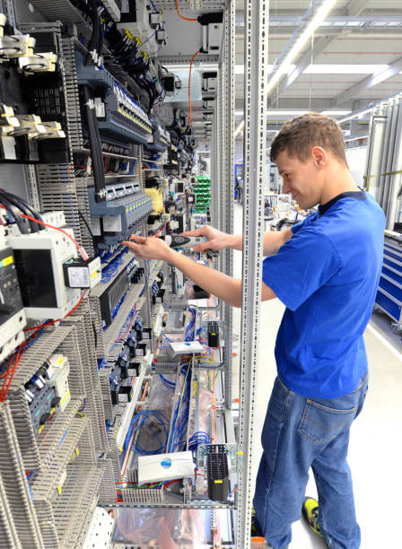 istock young apprentice worker in an industrial company assembling electronic components in the mechanical engineering of a modern factory 1271147777