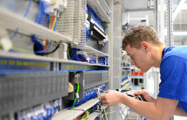 istock young apprentice worker in an industrial company assembling electronic components in the mechanical engineering of a modern factory 1271147847