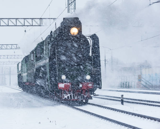 istock Retro steam train departs from the railway station. 1271148738