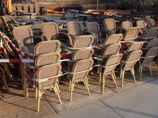 istock Stacked Restaurant Chairs Due To COVID-19 Quarantine 1271148840