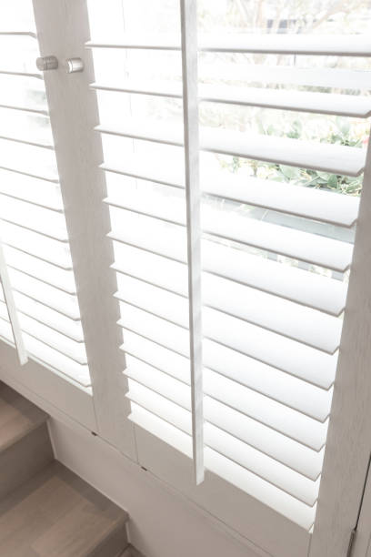 istock Closeup view of window with horizontal blinds. 1271150739