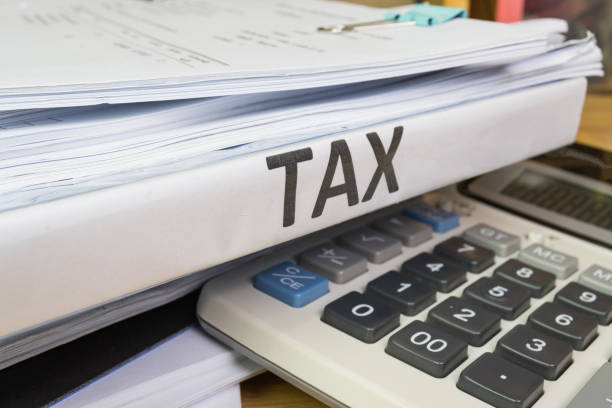 Folder Tax documents and paper files with calculator concept Annual tax payment Folder Tax documents and paper files with calculator concept Annual tax payment section 125 tax stock pictures, royalty-free photos  images