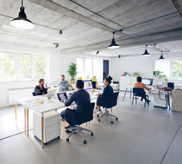 istock Business professionals working at new office desk 1271153817
