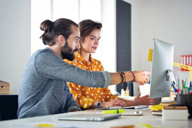 istock Business professionals working at new office desk 1271153884