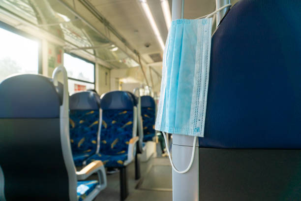 istock Empty inside train bus subway public transport with window view and blue seats people tourist new normal social distancing safe travel with hygiene face mask protect from covid corona virus 1271154937