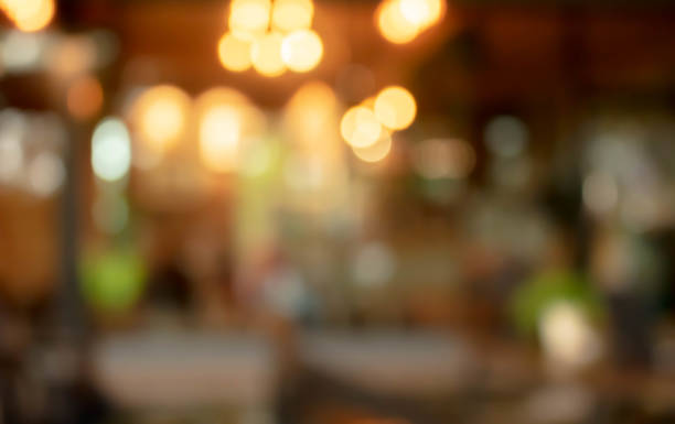 istock abstract blur of interior inside coffee cafe shop background with light effect for design element. Blurred cafe background with bokeh. orange ,red, light. 1271156648