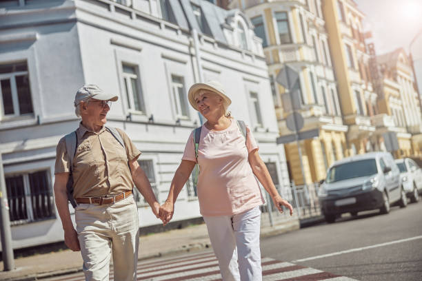istock Smiling tourists strolling around the city center 1271158037