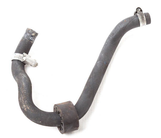 istock Black plastic hose of the car engine cooling system on a white isolated background in a photo studio for replacement during repair or for a catalog of spare parts for sale on auto disassembly. 1271165005