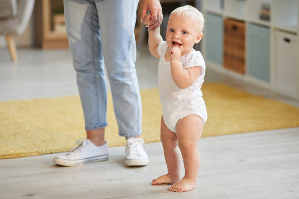 istock Baby And Mom Holding Hands To Walk 1271167414