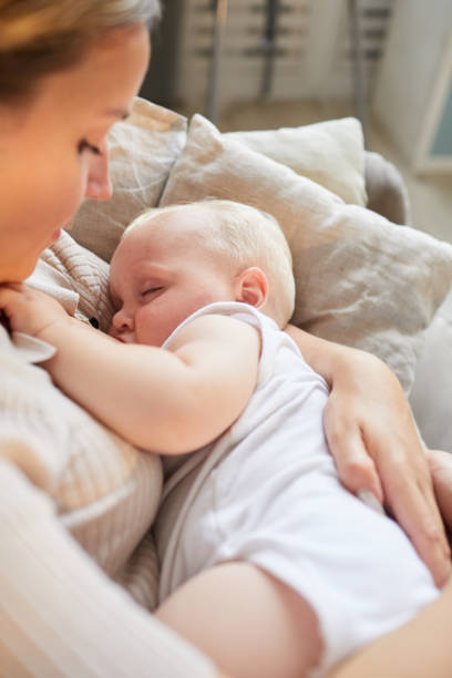 istock Mother Cuddling Baby 1271167497
