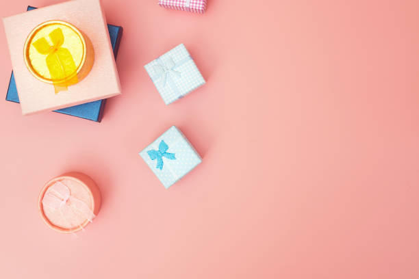 istock Gift boxes on a pink pastel background, copies space, flatlay 1271168034
