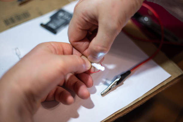 istock in the hands of a burning LED 1271168349