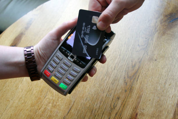 istock coronavirus ban concept -contactless payment card pdq background copy space with hand holding credit card ready to pay at cafe coffee shop smartcard stock, photo, photograph, picture 1271170614
