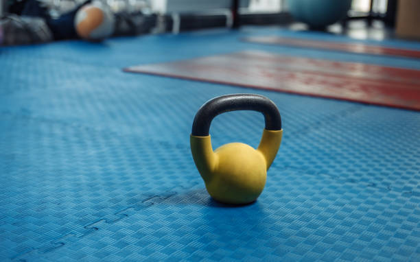 istock Kettlebell on the floor with blue rubber coating in the gym 1271171431