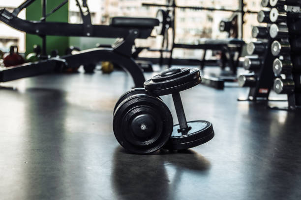 istock Two heavy dumbbells close-up in the gym 1271171540