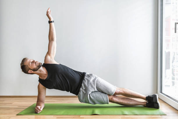istock Handsome man working out at home 1271173656
