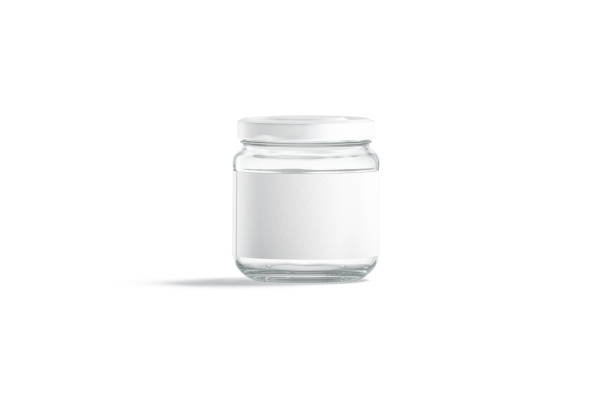 istock Blank small glass jar with white label mockup stand, isolated 1271175583