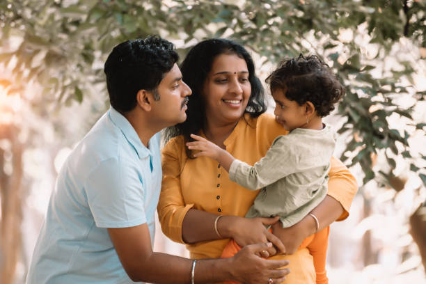 istock Family has fun playing in the park 1271175598