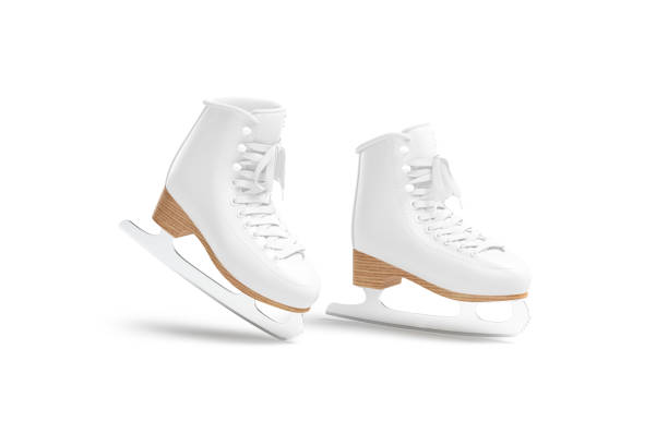 Pair of figure skates on ice, flat lay