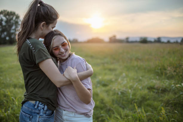 istock Embracing lesbian couple in nature 1271177499