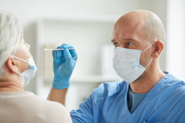 istock Doctor Taking Nasal Swab 1271178758
