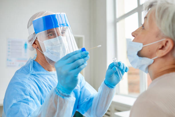 istock Testing Senior Woman For Covid-19 1271178778