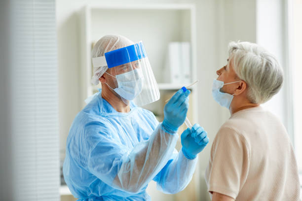 istock Laboratory Worker With Senior Woman 1271178780