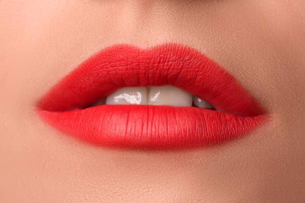 istock Beautiful female lips close up. Red lipstick. Luxury makeup. 1271178961